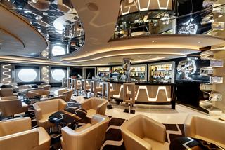 A modern and inviting bar and lounge area on MSC Grandiosa, perfect for socialising and relaxation | MSC Cruises