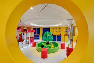 The kids' club features a fun LEGO play area in a vibrant setting | MSC Cruises