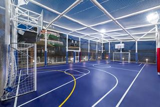 A vibrant sports arena on MSC Seaview offers various activities like basketball, volleyball, and tennis for all guests | MSC Cruises