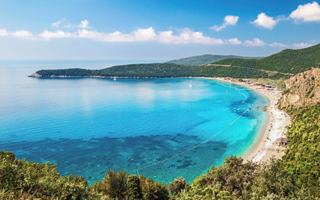 A stunning view of a serene beach and turquoise waters along the coastline of Montenegro | MSC Cruises