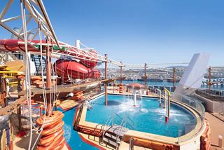 Aquapark featuring waterslides and a pool aboard MSC Bellissima | MSC Cruises