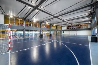 A spacious Sportplex area with a smooth blue floor and ample room for various sports activities | MSC Cruises