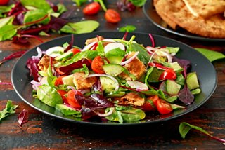 A vibrant fattoush salad featuring fresh vegetables and pita bread, celebrating flavours of the United Arab Emirates | MSC Cruises