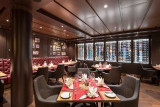 A warm and inviting dining area featuring elegant decor and tables set for a delightful meal | MSC Cruises