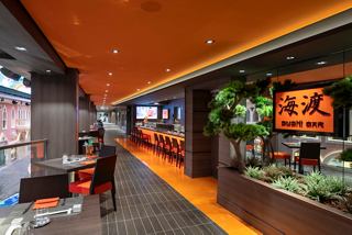 A welcoming corridor leading to the vibrant Kaito Sushi Bar, featuring modern decor and inviting dining spaces | MSC Cruises