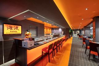 A vibrant interior view of Kaito Sushi Bar with seating and a welcoming atmosphere | MSC Cruises