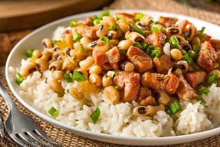 A hearty serving of Hoppin’ John featuring rice, meat, legumes, and vegetables garnished with fresh herbs | MSC Cruises
