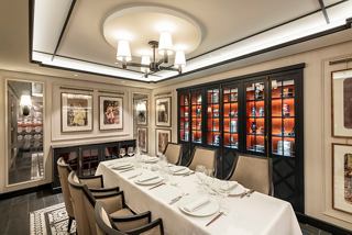 A beautifully arranged dining area featuring elegant furnishings and warm lighting | MSC Cruises
