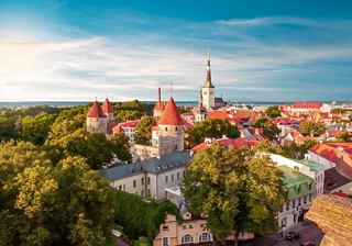 A panoramic view of Tallinn showcasing its historic towers and green landscape, inviting exploration of Estonia's beauty | MSC Cruises