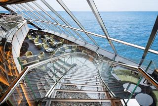 A scenic view from the Top Sail Lounge, showcasing the stylish staircase and sea beyond | MSC Cruises