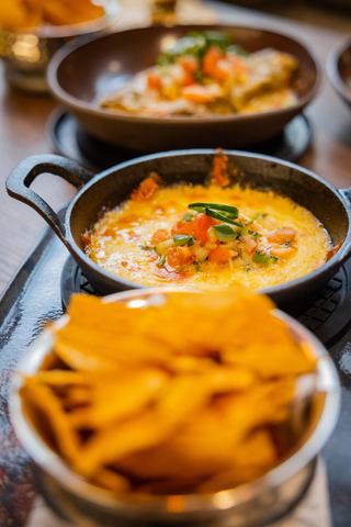 A vibrant display of delicious dishes, featuring tacos and creamy sauces, inviting a delightful dining experience | MSC Cruises