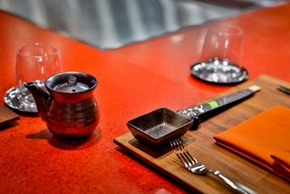 A beautifully set table with chopsticks and glassware, ready for a dining experience at Kaito Teppanyaki | MSC Cruises