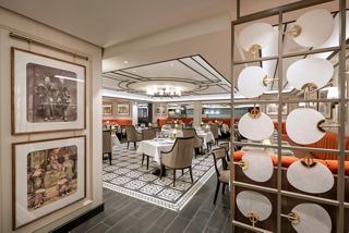 A welcoming view of the Indochine Restaurant with elegant decor and dining tables set for a memorable experience | MSC Cruises