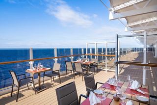Outdoor dining area with stunning sea views on MSC Seashore | MSC Cruises