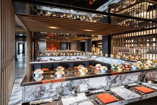 A welcoming interior of the Kaito Sushi Bar, featuring stylish seating and modern decor for an enjoyable dining experience | MSC Cruises
