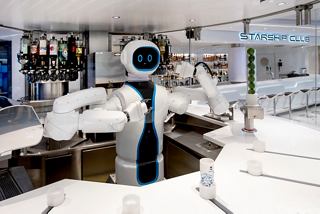 A futuristic robot bartender serving drinks at MSC Starship Club on MSC Virtuosa, showcasing innovation in hospitality | MSC Cruises