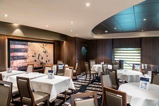 A cozy restaurant featuring elegant tables and a warm ambiance, ready to provide an unforgettable experience | MSC Cruises
