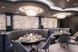 Modern restaurant featuring comfortable seating and elegant lighting, ready to offer an unforgettable experience | MSC Cruises