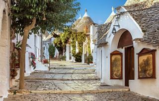 Charming streets lined with traditional Trulli houses in Alberobello, Italy, inviting exploration and cultural discovery | MSC Cruises