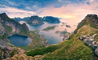 A breathtaking aerial view of the Lofoten Islands showcasing mountains, sea, and lush vegetation | MSC Cruises