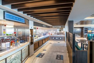 A spacious dining area featuring the Marketplace Buffet on MSC Virtuosa, inviting guests to enjoy diverse culinary options | MSC Cruises