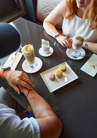 Couple at table with desserts and sweets aboard MSC Virtuosa | MSC Cruises