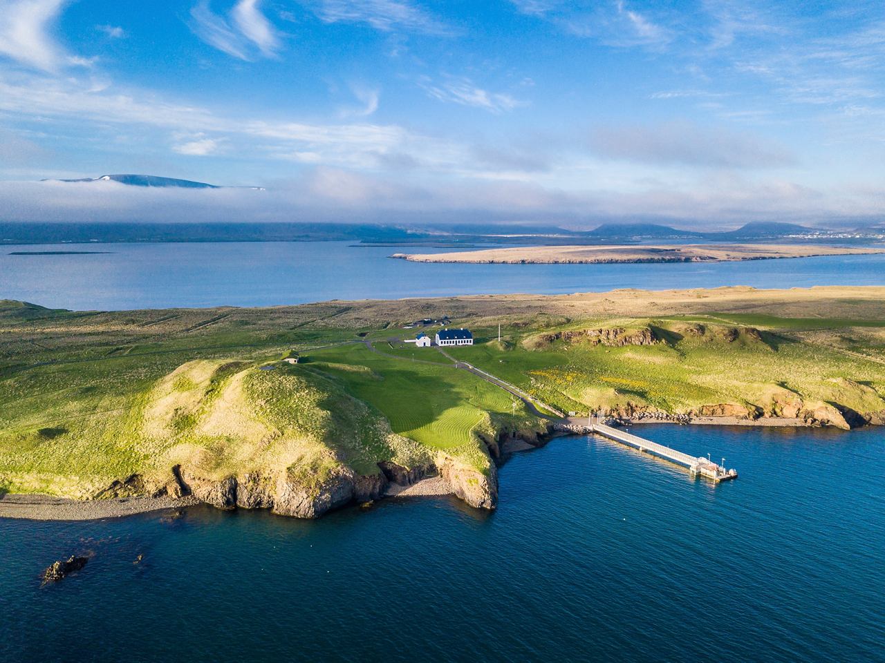 A breathtaking aerial view of a lush coastline in Reykjavik, Iceland, showcasing the blend of land and sea | MSC Cruises