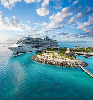 Le navire MSC Seashore ancré à côté d'une magnifique île tropicale dans les Caraïbes | MSC Cruises