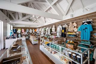 A vibrant retail space showcasing a variety of souvenirs and apparel at Ocean Cay MSC Marine Reserve | MSC Cruises