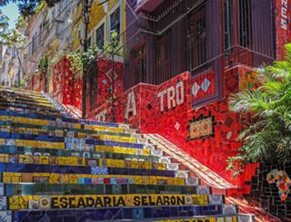 Vibrant steps of Escadaria Selarón in Rio de Janeiro, showcasing colourful mosaics and lively surroundings | MSC Cruises