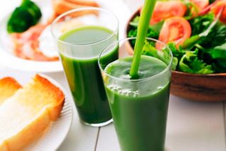 Refreshing green juices served with a side of fresh salad and bread, perfect for a healthy meal on MSC World Europa | MSC Cruises