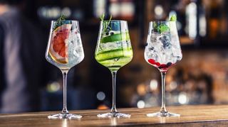 Three colourful cocktails in elegant wine glasses, showcasing vibrant ingredients and refreshing flavours | MSC Cruises