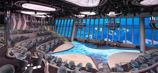 Spacious entertainment area with comfortable seating and bright screens | MSC Cruises