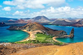 A stunning view of Bartolome Island showcasing its mountains and turquoise waters, inviting adventure and exploration | MSC Cruises