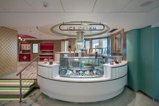 A welcoming frozen yogurt and ice cream bar with a modern design inviting guests to indulge in delightful treats | MSC Cruises