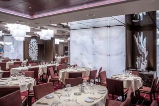 Elegant dining setting at the Cala Jondal Restaurant, featuring beautifully arranged tables and sophisticated decor | MSC Cruises