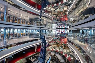 A vibrant view of the bustling entertainment area on MSC Seascape, showcasing shops and dining spaces | MSC Cruises