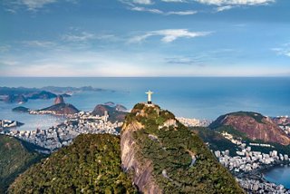 Panoramic view of Rio de Janeiro featuring Christ the Redeemer against the ocean backdrop | MSC Cruises