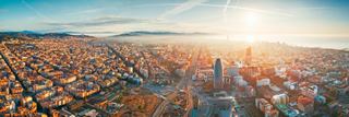 A breathtaking aerial view of Barcelona's skyline at sunrise, showcasing the beauty of the Mediterranean Sea | MSC Cruises