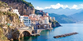 A picturesque coastal village along the cliffs of Italy, highlighting the beauty of the Mediterranean Sea | MSC Cruises