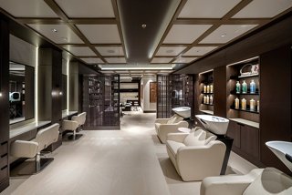 A stylish hair salon interior featuring elegant seating and modern decor for a relaxing experience | MSC Cruises