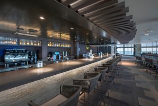 An inviting interior view of the Botanic Garden Bar, featuring a stylish bar counter and a welcoming atmosphere | MSC Cruises
