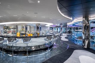 An inviting Champagne and Wine Bar with a sleek design, perfect for relaxation aboard MSC Seascape | MSC Cruises