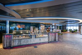A vibrant bar area featuring a stylish counter and comfortable seating invites relaxation on board the MSC Seascape | MSC Cruises