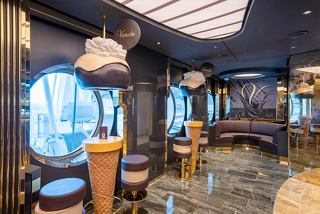 A stylish bar area with portholes and elegant seating, inviting guests to enjoy a delightful experience | MSC Cruises