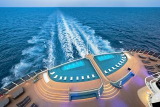 An aerial view of the MSC Seascape showcasing stunning infinity pools and open deck areas surrounded by the sea | MSC Cruises