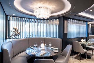A stylish restaurant setting featuring elegant seating and decor, inviting guests to enjoy a memorable dining experience | MSC Cruises