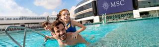 A family enjoys playful moments together at the La Plage Pool on board MSC World Europa | MSC Cruises