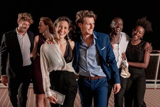 A group of friends enjoying a lively evening together on the deck of MSC World Europa | MSC Cruises