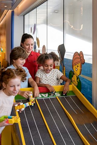 Children enthusiastically engage in a fun activity together in the LEGO Room on MSC World Europa | MSC Cruises